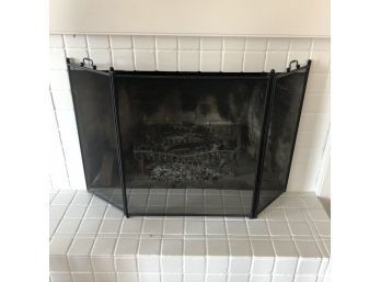 A Tri Fold Metal Fire Screen