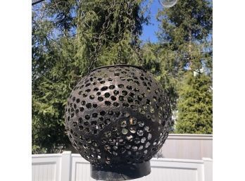 A Perforated Metal Hanging Lantern - A Bit Smaller Than A Soccer Ball