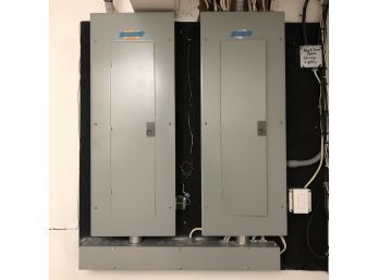 A Pair Of GE Power Mark Gold Load Center Electrical Panel Boxes