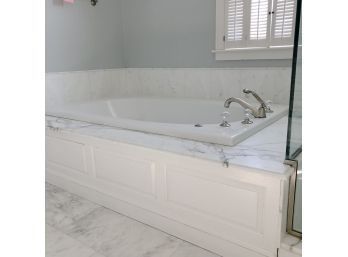 A Pearl Jetted Spa Tub With Waterworks Hardware And 4 Piece Marble Top