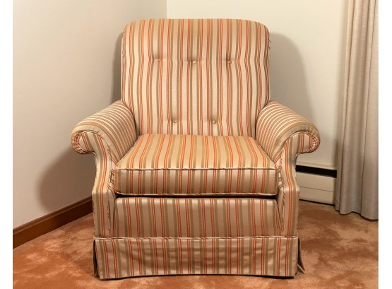An Upholstered Arm Chair In A Tasteful Stripe