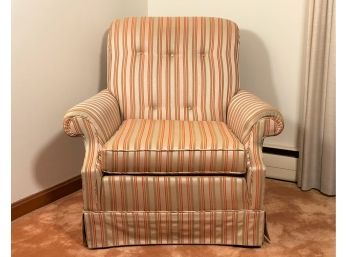 An Upholstered Arm Chair In A Tasteful Stripe