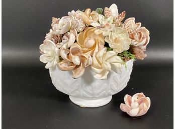 A Faux Floral Arrangement Made Entirely Of Sea Shells