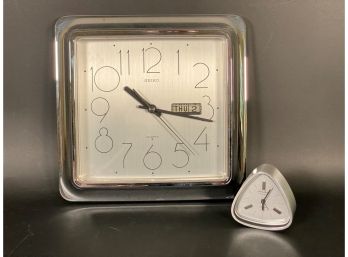 A Pair Of Silver-Toned Clocks: