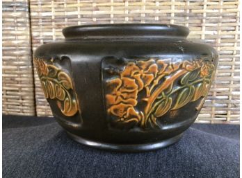 Early Black Pottery With Orange Foliage