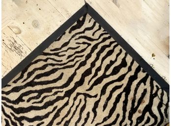 A Glamorous Zebra Rug With Woven Trim From ABC Carpet & Home