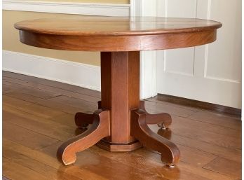 An Antique Oak Round Dining Table