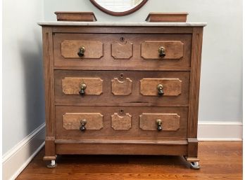 An Eastlake Victorian Marble Top Chest Of Drawers In Light Mahogany