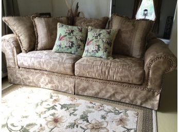 Brown And Tan Cloth Sofa With Throw Pillows
