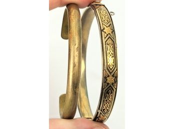 Pair Of Brass Bracelets 1 Is A Black Bangle With Enamel Graphics