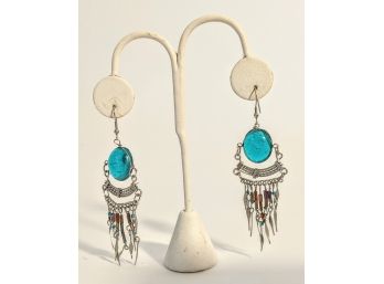 Dazzling Silver Dangling Pierce Earrings With A Large Baby Blue Stone