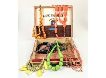 Larger-Than-Life Charm Necklaces In An Alec Bradley Cigar Box