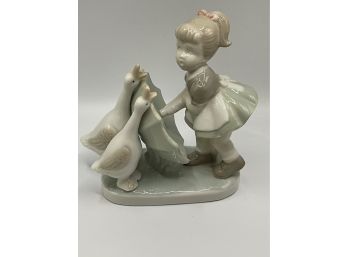 A Woodmere Figurine Of A Young Girl With An Umbrella