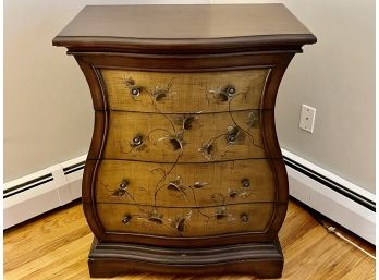 A Four Drawer Dresser With Hour Glass Curvature