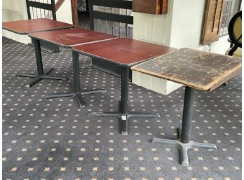 A Group Of 4 Cafe Tables With 'X' Bases