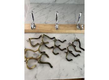 11 Brass Hooks And A Board With Chrome Hooks