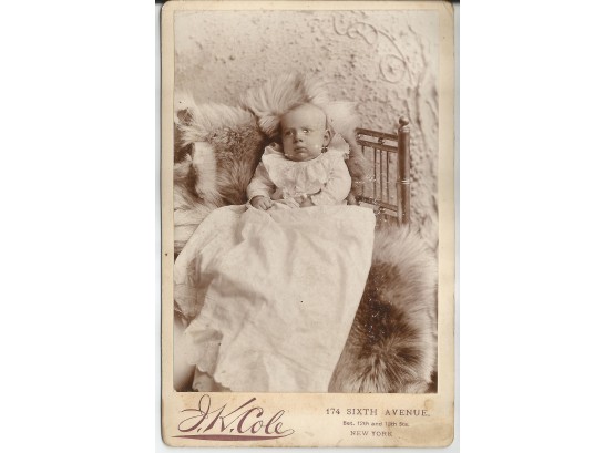 Cabinet Photo Of Baby Resting On Furs