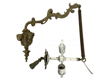Antique Brass Faces And Dragon Wall Sconce With Swinging Arm