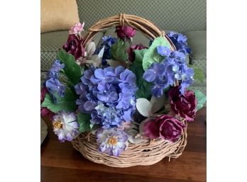 Artificial Floral Arrangement In A Large Wicker Basket