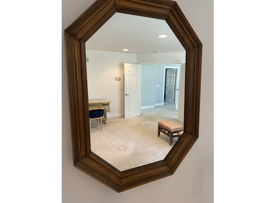 An Octagonal Wooden Mirror By Baker Furniture