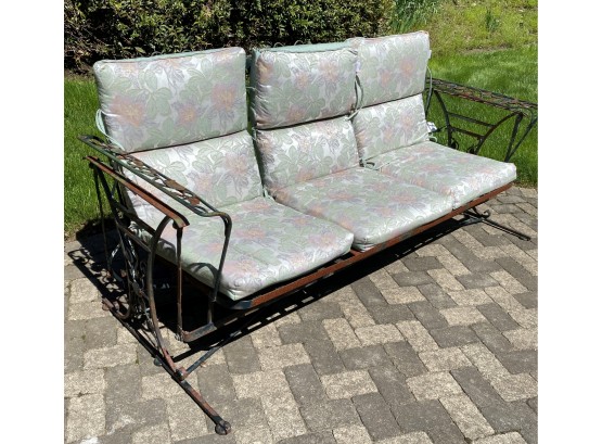 A Vintage Wrought Iron Outdoor 3 Cushion Glider Sofa With Sunbrella Cushions