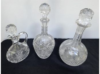 A Group Of Three Vintage Cut Crystal Decanters