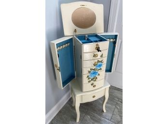 A Decorative White Jewelry Cabinet With Key