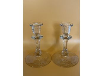 A Pair Of Glass Candlesticks With Beautiful Detail
