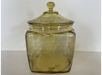 A Beautiful Yellow Glass Jar With Lid