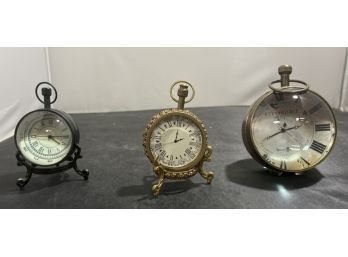 Trio Of Contemporary Paris Style Clocks ( 2 Have Compass On Opposite Side).  2 With Stands 1 Self Standing C2