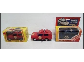 Vintage Toys - 2 New In Boxes - Mechanical Range Rovers - (2)  Fire Chief & 1 Battery Op. Police Vehicle  D5