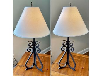 A Pair Of Cast Iron Lamps