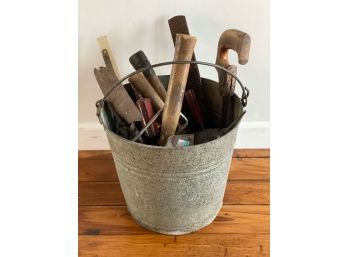 A Metal Bucket Full Of Tools And Stuff #1