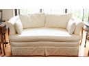 Custom Sateen Damask Upholstered Pillow Curved Rolled Back Loveseat With Rolled Arms And A Pleated Skirt