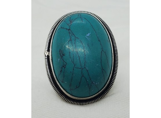 Size 7 Sterling Silver Plated Ring With A 1 1/8' X 3/4' Synthetic Turquoise