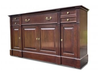 A Traditional Paneled Cherry Wood Sideboard By Harden Furniture