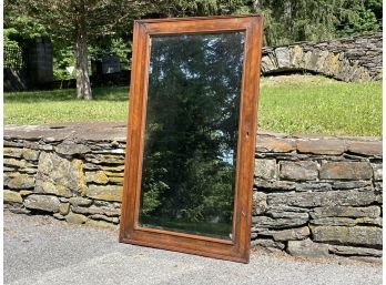 A Large Antique Beveled Mirror