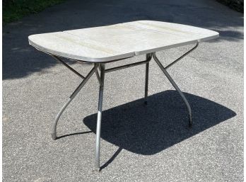 A Vintage 1960's Formica And Chrome Drop Leaf Dining Table