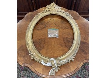 A Large Gilt And Plaster Oval Frame - AS IS