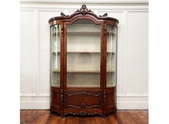A Gorgeous Antique Carved Mahogany Curved Glass China Cabinet