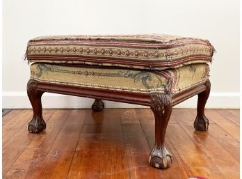 An Antique Claw Footed Ottoman