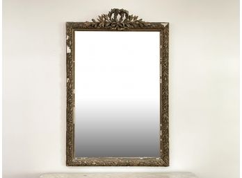 An Antique Gilt And Plaster Framed Mirror