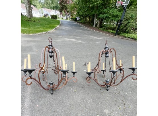 A Romantic Pair Of Rustic Wrought Metal With Wood Base Chandeliers
