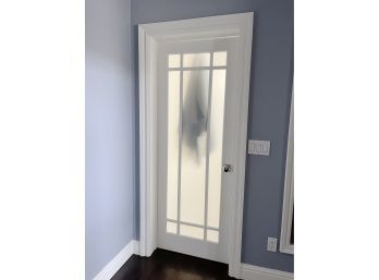 A Mission Style 9 Lite Frosted Wood Door - Primary Bathroom