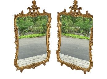 A Pair Of Ornately Carved Wood Gold Mirrors In Regency Style
