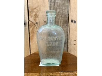 Antique Green Embossed Glass Bottle Warranted Flask