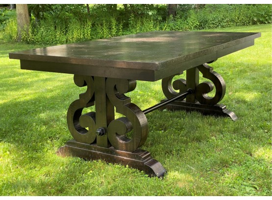 A Substantial Trestle Table With A Distressed Plank Top