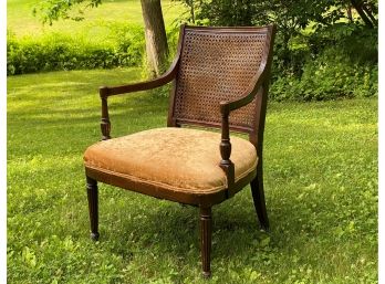 A Very Stylish Vintage Arm Chair With A Caned Back #1