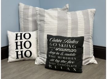 A Grouping Of Throw Pillows In Black & White