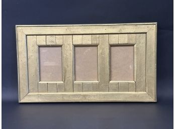 A Rustic Gilt Wood Frame With Three Picture Openings